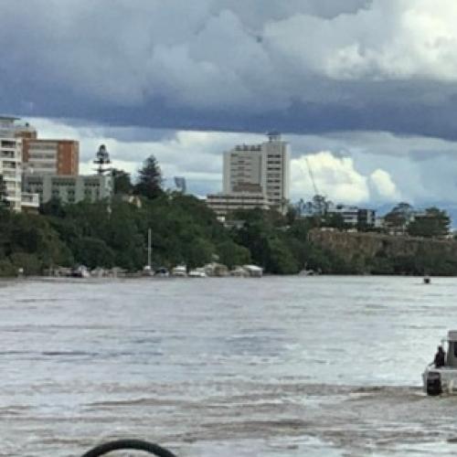 Parts of Brisbane CBD evacuated with crane on loose in river