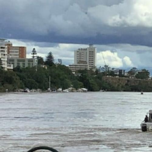 Parts of Brisbane CBD evacuated with crane on loose in river