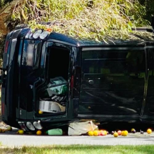 4WD clips a tree and rolls across busy Gold Coast road