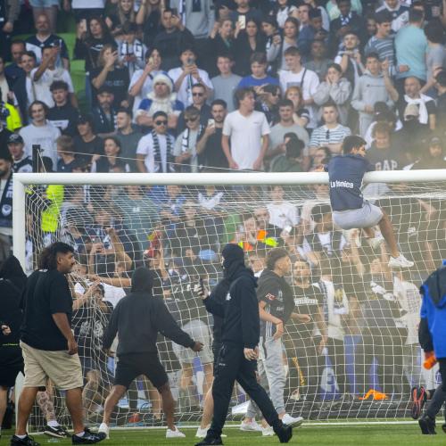 Victory sanctioned after pitch invasion