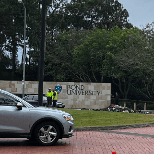 Garbage truck caught alight on the Gold Coast, hospitalising driver