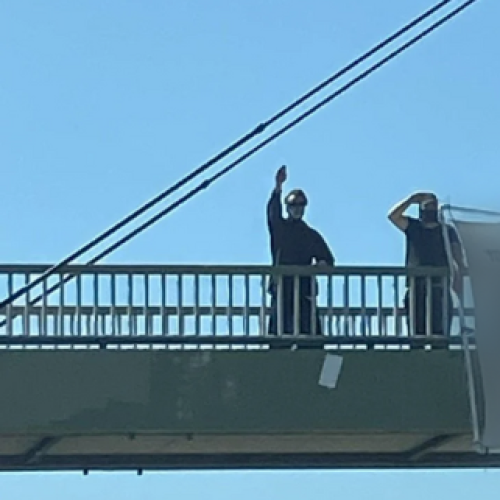 Three men charged over hate symbol display on the Gold Coast