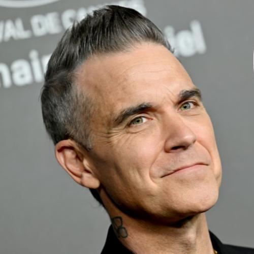 Robbie Williams Opens Up About His “Car Crash TV” Life in New Netflix Documentary