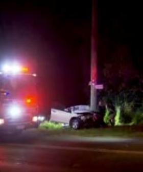 Two injured after car wraps around power pole in horror Gold Coast crash