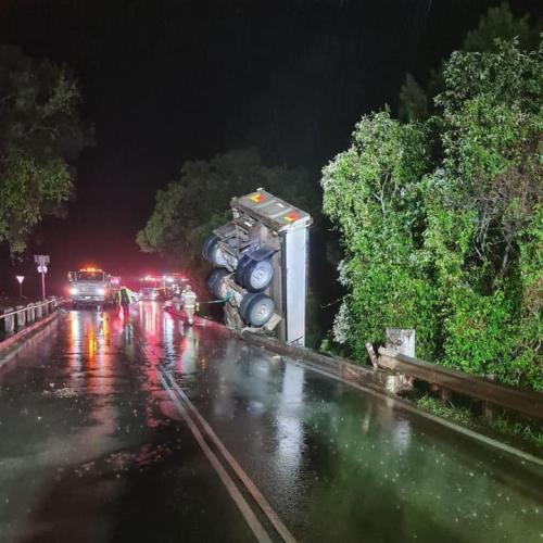 Truck left dangling off bridge after northern Gold Coast crash