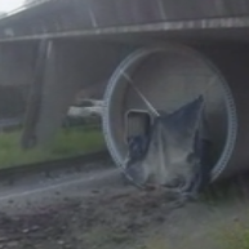 Major highway closed after oversized truck crashes into bridge