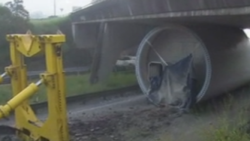 Major highway closed after oversized truck crashes into bridge