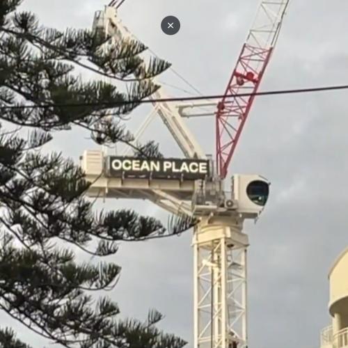 Man surrenders after climbing crane in Burleigh Heads