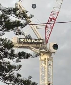 Man surrenders after climbing crane in Burleigh Heads