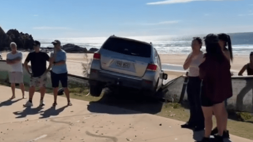 Driver fined after runaway SUV ploughs onto busy Gold Coast beach