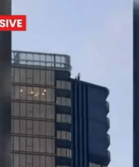 Thrill seekers dangerous stunt on top of Gold Coast high-rise