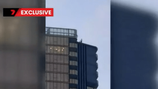 Thrill seekers dangerous stunt on top of Gold Coast high-rise