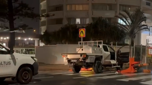 Two injured, man charged after ramming into metal barrier